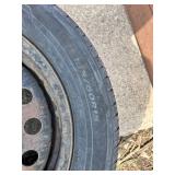 Lot of 3 Wheels and Tires Including Bridgestone Dueler H/P 235/65R on 5-Lug Alloy Wheel, Laufenn G Fit 195/60R15 on Steel Rim, and Dodge Rim