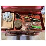 Metal Tool Chest with Tools including screwdrivers, hammers, saws, measuring tapes, and brushes