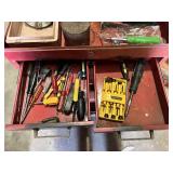 Metal Tool Chest with Tools including screwdrivers, hammers, saws, measuring tapes, and brushes