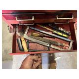 Metal Tool Chest with Tools including screwdrivers, hammers, saws, measuring tapes, and brushes