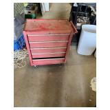 Craftsman Red Tool Chest with Tools such as screwdrivers, levels, and clamps
