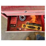 Craftsman Red Tool Chest with Tools such as screwdrivers, levels, and clamps