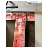 Assorted Levels and Measuring Tools including Laser Level, Stanley Level, Metal T-Square, and Carpenter Levels