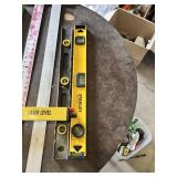 Assorted Levels and Measuring Tools including Laser Level, Stanley Level, Metal T-Square, and Carpenter Levels