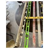 Assorted Levels and Measuring Tools including Laser Level, Stanley Level, Metal T-Square, and Carpenter Levels