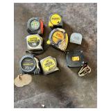 Various Tape Measures Including Stanley PowerLock, Komelon Gripper, and American Family Insurance