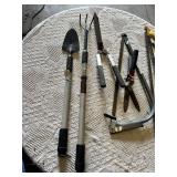 Garden hand tools including trowel, garden fork, hedge shears, pruning shears, and bow saws Set
