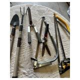 Garden hand tools including trowel, garden fork, hedge shears, pruning shears, and bow saws Set