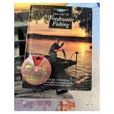 Maps, fishing guides, and fishing gear with binoculars and telescopes.