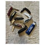 Knife collection including Gerber and Winchester knives, and a Sunnen honing stone