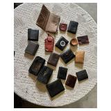 Lot of assorted wallets and small cases in various styles, materials, and colors including leather and fabric.