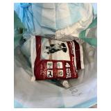 Various pet accessories including leashes, harnesses, and training tools, with dog-related supplies such as pee pads