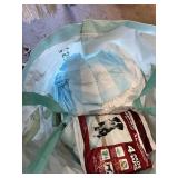 Various pet accessories including leashes, harnesses, and training tools, with dog-related supplies such as pee pads