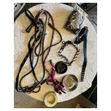 Dog care items including pet carrier, leashes, collars, bowls, and booties