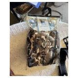 Dog care items including pet carrier, leashes, collars, bowls, and booties