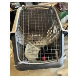 Dog care items including pet carrier, leashes, collars, bowls, and booties