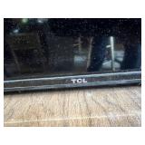 TCL Flat Screen TV with HDMI and AV Inputs 56 1/2" Wide - Lights Up in Back, Needs Remote