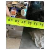 TCL Flat Screen TV with HDMI and AV Inputs 56 1/2" Wide - Lights Up in Back, Needs Remote