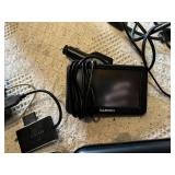 Lot of Electronics and Accessories including RCA Portable DVD Player Monitors, Garmin GPS, and Red Media Player with Cables