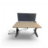Steelcase Power Sit Stand Desk with Privacy Divider & Power Pack. The desk measures 48" wide / 29" deep / adjusts between 22.5" to 48" tall