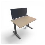 Steelcase Power Sit Stand Desk with Privacy Divider & Power Pack. The desk measures 48" wide / 29" deep / adjusts between 22.5" to 48" tall