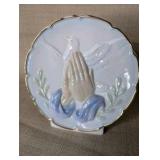 Vintage ceramic decorative plate features a 3D praying hands and dove design