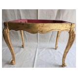Italian Florentine side table from the 1950s,distinctive weathered gold gilt finish over a red base