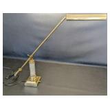 House of Troy polished brass desk lamp, adjustable swing arm and a fluted crystal column