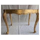 Italian Florentine side table from the 1950s,distinctive weathered gold gilt finish over a red base
