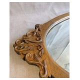 Antique Victorian wall mirror, beautifully carved oak frame and a distinct oval design