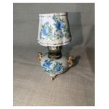 Vintage Royal Crown miniature oil lamp featuring hand-painted blue floral motifs and gold trim