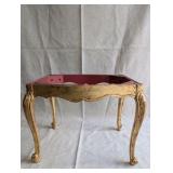 Italian Florentine side table from the 1950s,distinctive weathered gold gilt finish over a red base