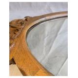 Antique Victorian wall mirror, beautifully carved oak frame and a distinct oval design