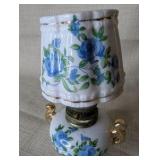 Vintage Royal Crown miniature oil lamp featuring hand-painted blue floral motifs and gold trim