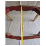 Italian Florentine side table from the 1950s,distinctive weathered gold gilt finish over a red base