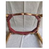 Italian Florentine side table from the 1950s,distinctive weathered gold gilt finish over a red base