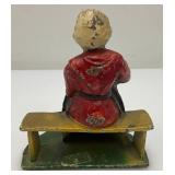 Vintage Heavy Cast Iron Old Woman On Bench Door Stop 3" x 4" x 5"