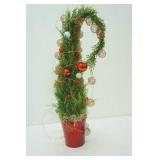 whimsical 24" artificial Christmas Tree often referred to as a "Grinch Tree"