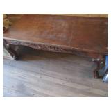 Carved wood coffee table