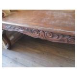Carved wood coffee table