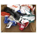 Assorted pairs of new football clea...