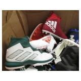 Assorted pairs of new football clea...