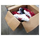 Assorted pairs of new football clea...