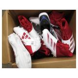 Assorted pairs of new football clea...