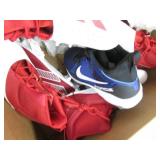 Assorted pairs of new football clea...