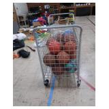 BASKETBALL CAGE ON WHEELS WITH LOTS OF BASKETBALLS