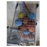 BASKETBALL CAGE ON WHEELS WITH LOTS OF BASKETBALLS