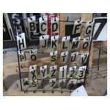 3 RACKS PLUS LOTS OF SELF REFLECTING LETTERS AND NUMBERS
