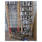 3 RACKS PLUS LOTS OF SELF REFLECTING LETTERS AND NUMBERS