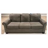 Ashley 3-Cushion Gray Sofa With Nailhead Trim - Matches Lot 21